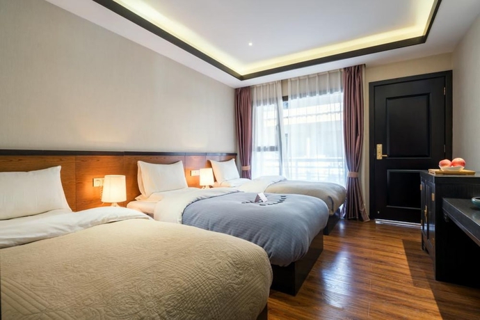 Imagen de la habitación del Hotel Shilily Travelling Lugu Lake. Foto 3