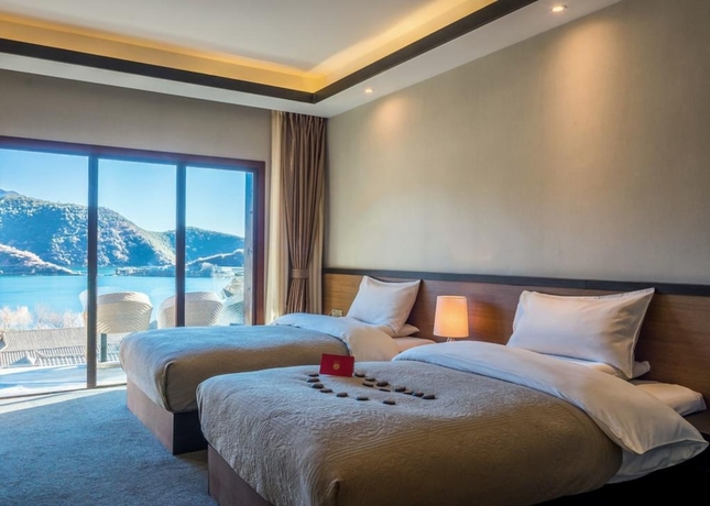 Imagen de la habitación del Hotel Shilily Travelling Lugu Lake. Foto 6