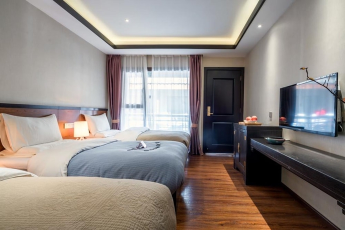 Imagen de la habitación del Hotel Shilily Travelling Lugu Lake. Foto 13