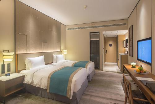 Imagen de la habitación del Hotel Shimao Yuluxe Chengdu. Foto 6
