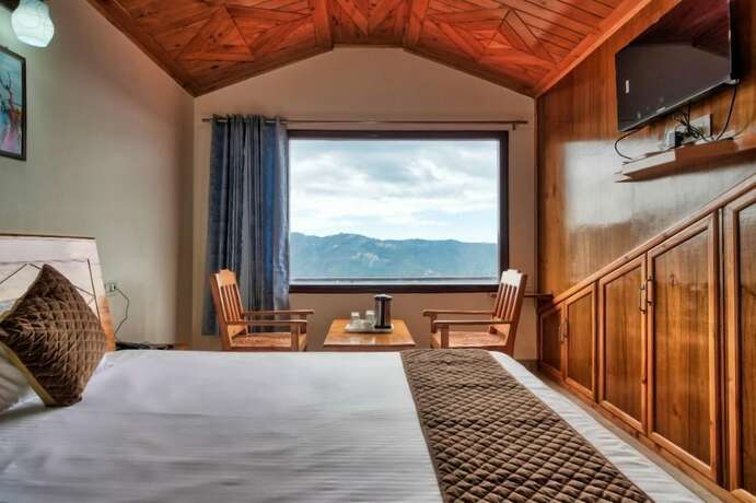 Imagen de la habitación del Hotel Shimla Alpine Regency. Foto 18