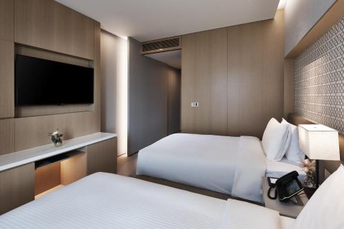 Imagen de la habitación del Hotel Shinhwa Jeju Shinhwa World Hotels and Resorts. Foto 9