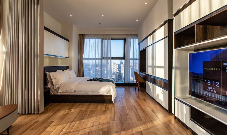 Imagen de la habitación del Hotel Shining Star Health Apartment. Foto 6