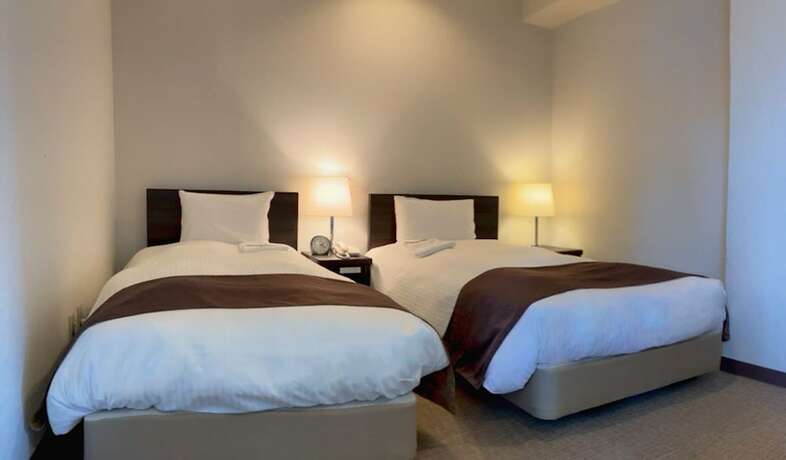 Imagen de la habitación del Hotel Shinjuku Sun Park. Foto 12