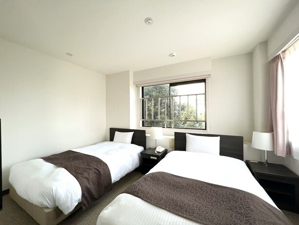 Imagen de la habitación del Hotel Shinjuku Sun Park. Foto 18