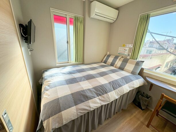 Imagen de la habitación del Hotel Shinjuku Warm House. Foto 13
