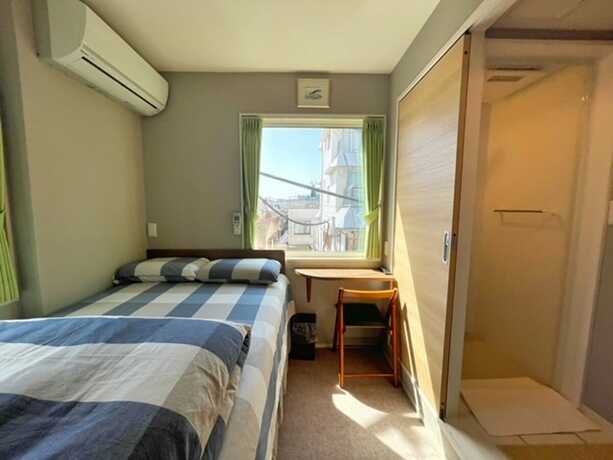 Imagen de la habitación del Hotel Shinjuku Warm House. Foto 15