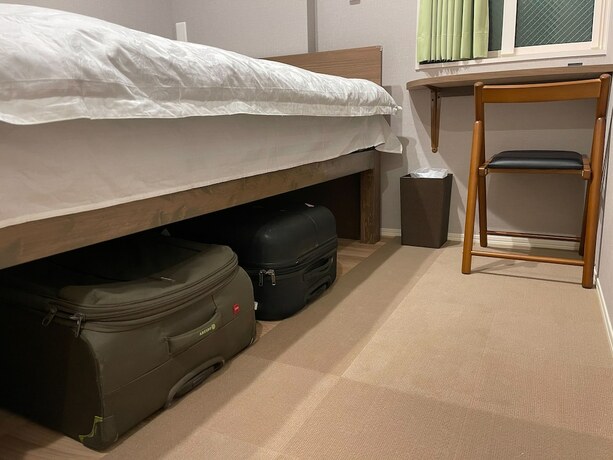 Imagen de la habitación del Hotel Shinjuku Warm House. Foto 17
