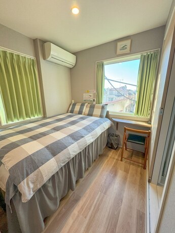 Imagen de la habitación del Hotel Shinjuku Warm House. Foto 18