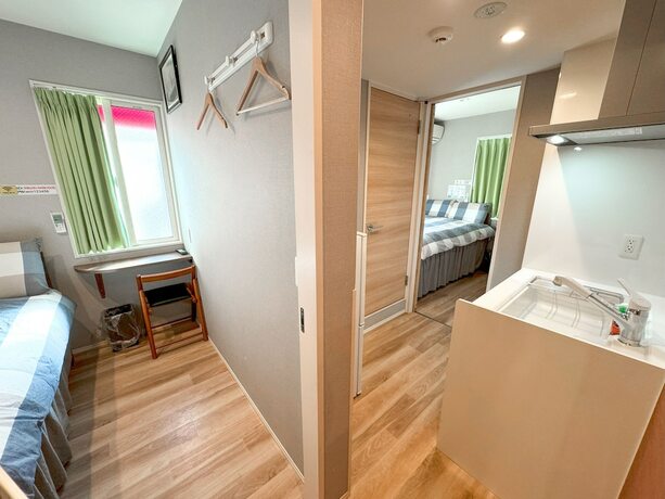 Imagen de la habitación del Hotel Shinjuku Warm House. Foto 19