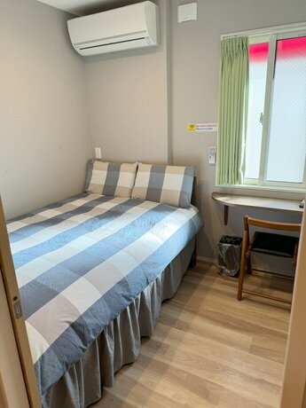 Imagen de la habitación del Hotel Shinjuku Warm House. Foto 20