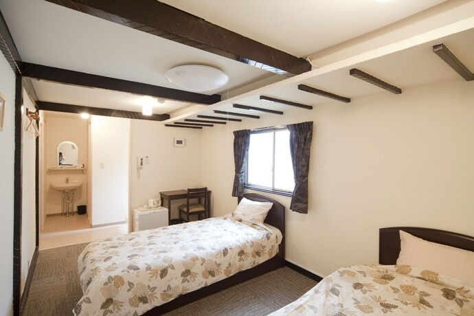 Imagen de la habitación del Hotel Shin-okubo International. Foto 18