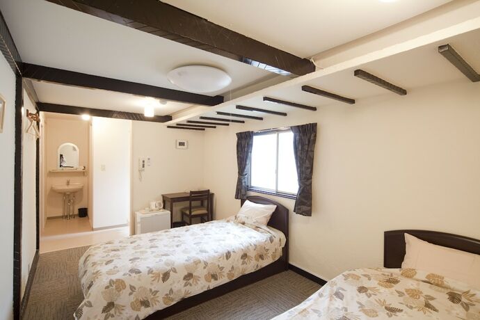 Imagen de la habitación del Hotel Shin-okubo International. Foto 19