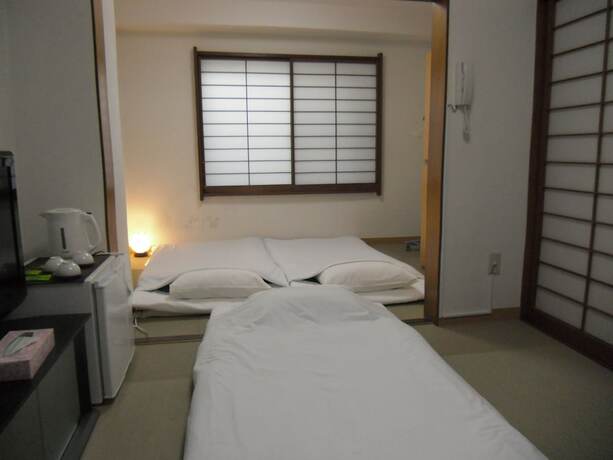 Imagen de la habitación del Hotel Shin-okubo Sekitei. Foto 18