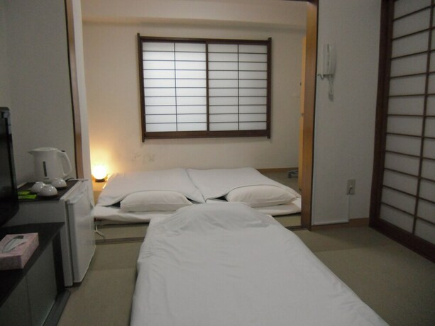 Imagen de la habitación del Hotel Shin-okubo Sekitei. Foto 26