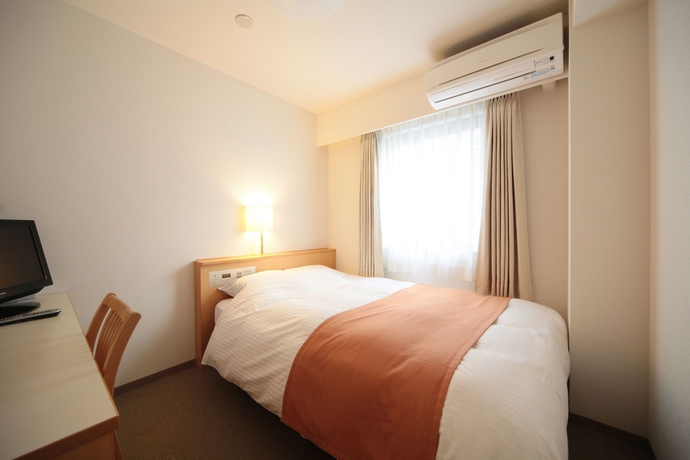 Imagen de la habitación del Hotel Shin-osaka Station. Foto 11