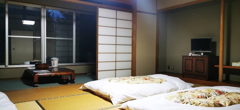 Imagen de la habitación del Hotel Shiozawa Onsen Shichihokan. Foto 8