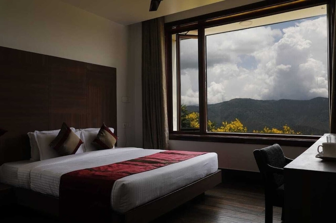 Imagen de la habitación del Hotel Shivani Foods And Resort. Foto 9
