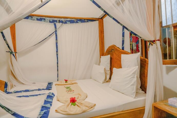 Imagen de la habitación del Hotel Shoki Shoki House Stone Town. Foto 19