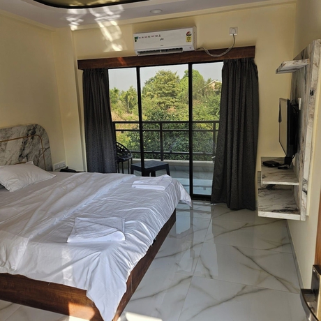 Imagen de la habitación del Hotel Shrikar Resort. Foto 5
