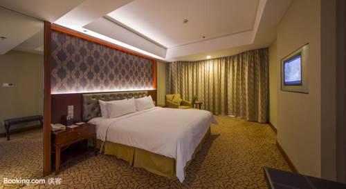 Imagen de la habitación del Hotel Shuguang International Hotel. Foto 8