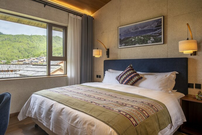 Imagen de la habitación del Hotel Shujiawuxiangluoguqingtubuminsu. Foto 11