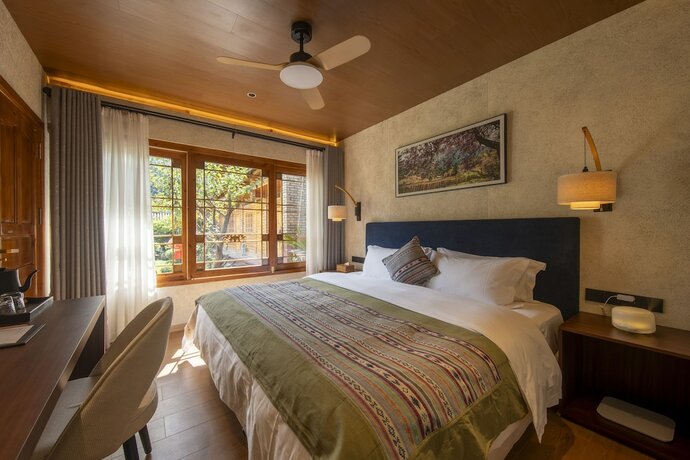 Imagen de la habitación del Hotel Shujiawuxiangluoguqingtubuminsu. Foto 15