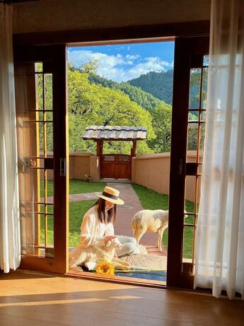 Imagen de la habitación del Hotel Shujiawuxiangluoguqingtubuminsu. Foto 17