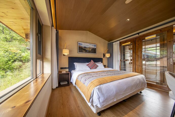 Imagen de la habitación del Hotel Shujiawuxiangluoguqingtubuminsu. Foto 19
