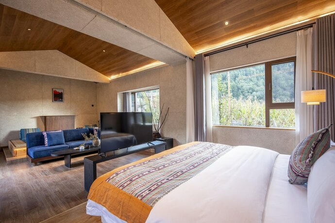 Imagen de la habitación del Hotel Shujiawuxiangluoguqingtubuminsu. Foto 20