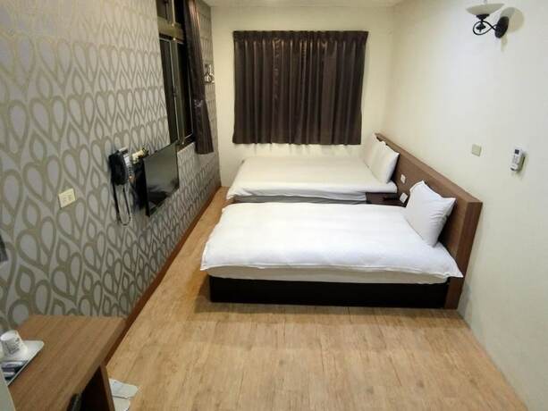 Imagen de la habitación del Hotel Shuntai Inn. Foto 14