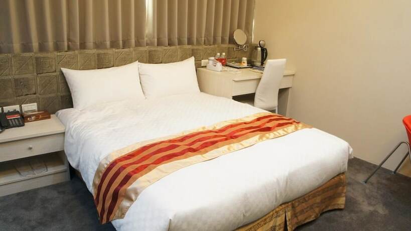 Imagen de la habitación del Hotel Shun-yi. Foto 16