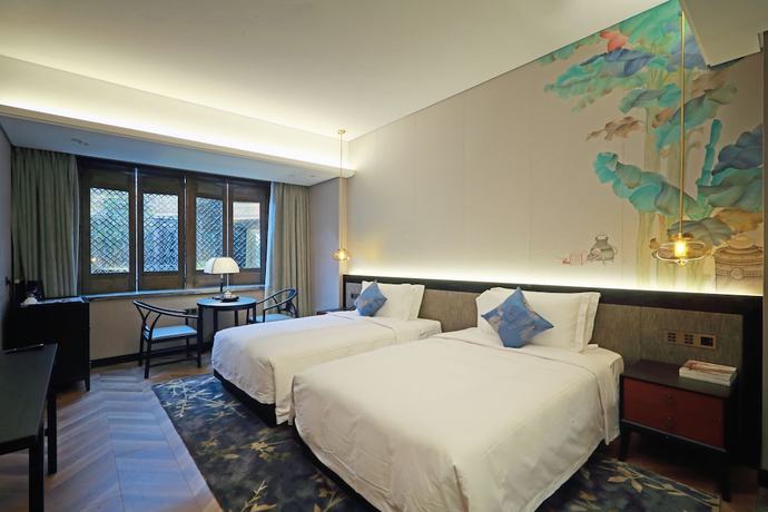 Imagen de la habitación del Hotel Shuxiang Wenru. Foto 13