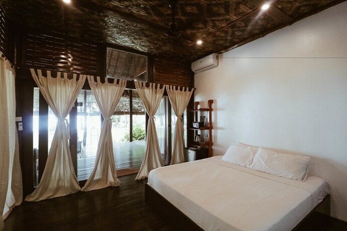 Imagen de la habitación del Hotel Siargao Island Villas. Foto 23