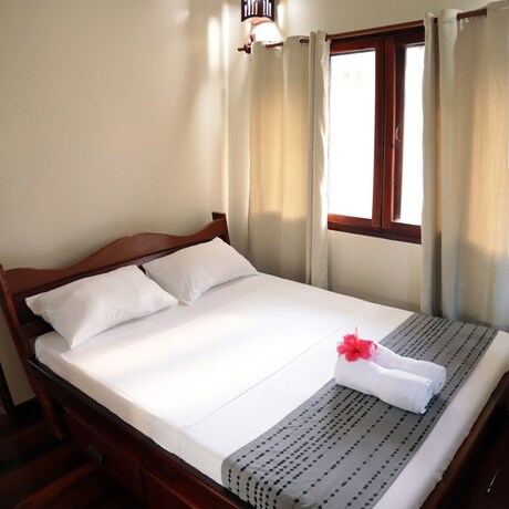 Imagen de la habitación del Hotel Siargao Sunrise Villa. Foto 9