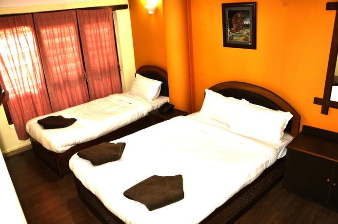 Imagen de la habitación del Hotel Siddhi Home and Restaurant. Foto 5