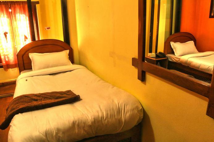 Imagen de la habitación del Hotel Siddhi Home and Restaurant. Foto 13