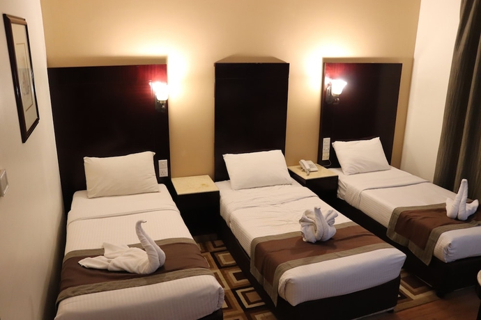 Imagen de la habitación del Hotel Signature Inn Deira. Foto 4