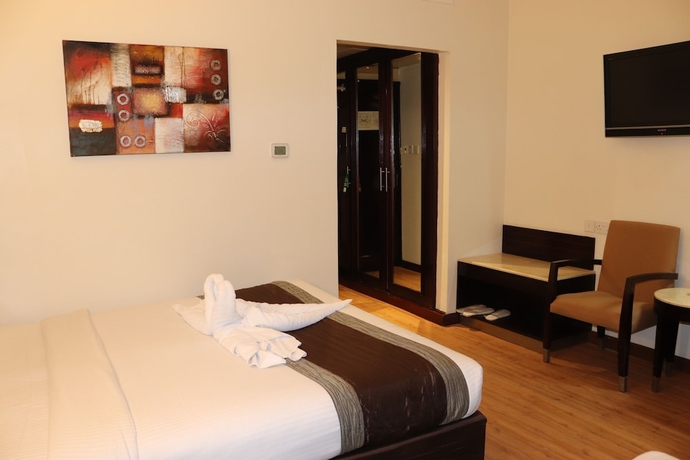 Imagen de la habitación del Hotel Signature Inn Deira. Foto 6