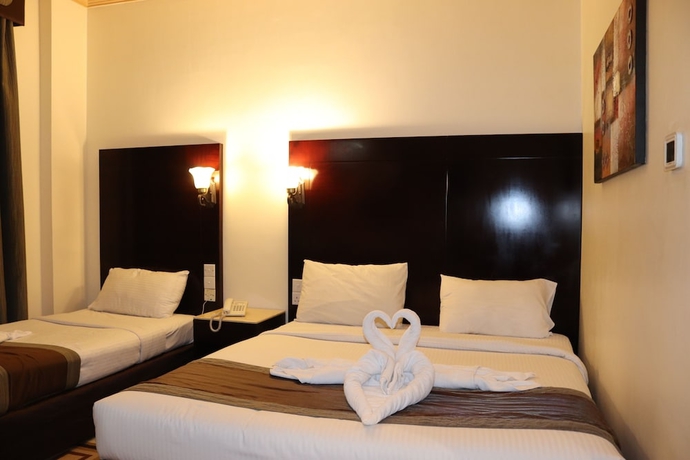 Imagen de la habitación del Hotel Signature Inn Deira. Foto 9