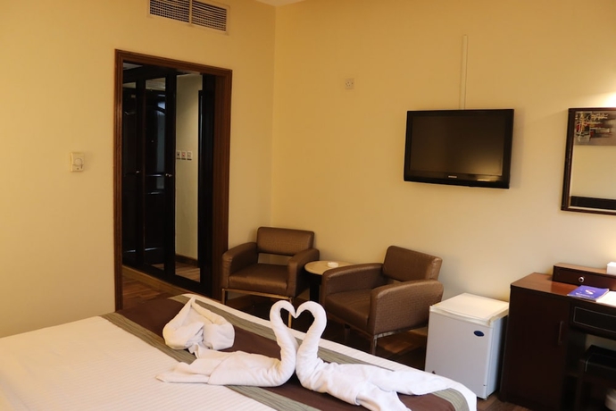 Imagen de la habitación del Hotel Signature Inn Deira. Foto 11