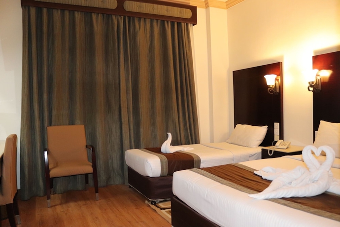 Imagen de la habitación del Hotel Signature Inn Deira. Foto 17