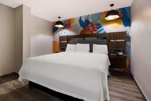 Imagen de la habitación del Hotel Signature Inn Houston Galleria. Foto 18