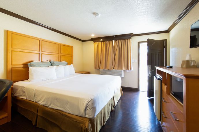 Imagen de la habitación del Hotel Signature Inn Merced Yosemite Parkway. Foto 4