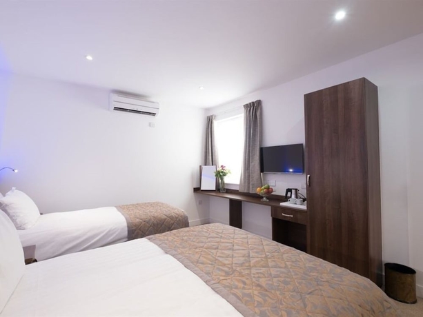 Imagen de la habitación del Hotel Signature London. Foto 16