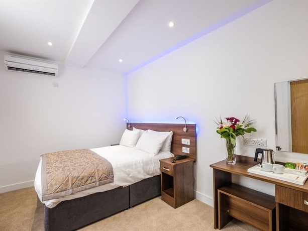 Imagen de la habitación del Hotel Signature London. Foto 17