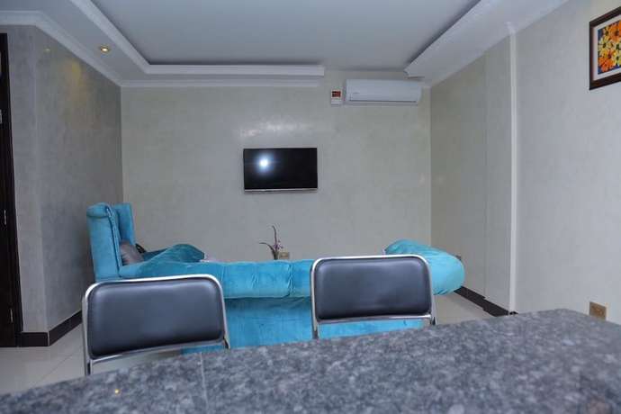 Imagen de la habitación del Hotel Signature Suites and. Foto 2