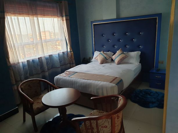 Imagen de la habitación del Hotel Signature Suites and. Foto 5