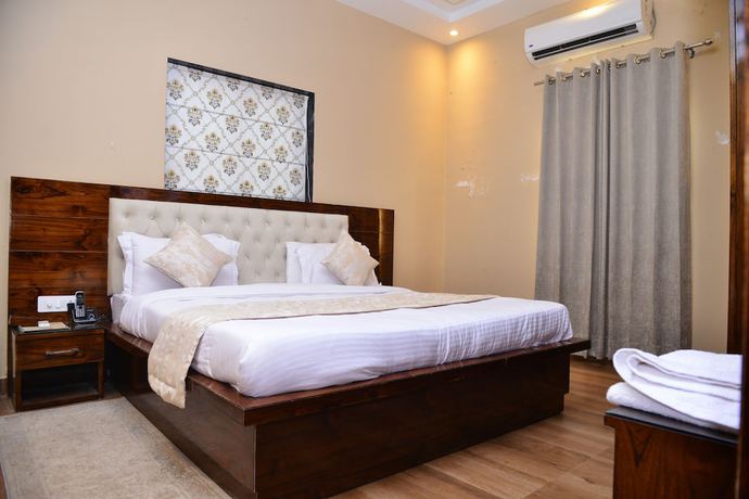 Imagen de la habitación del Hotel Signature Villa. Foto 8