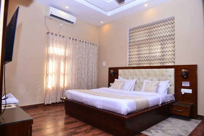 Imagen de la habitación del Hotel Signature Villa. Foto 16